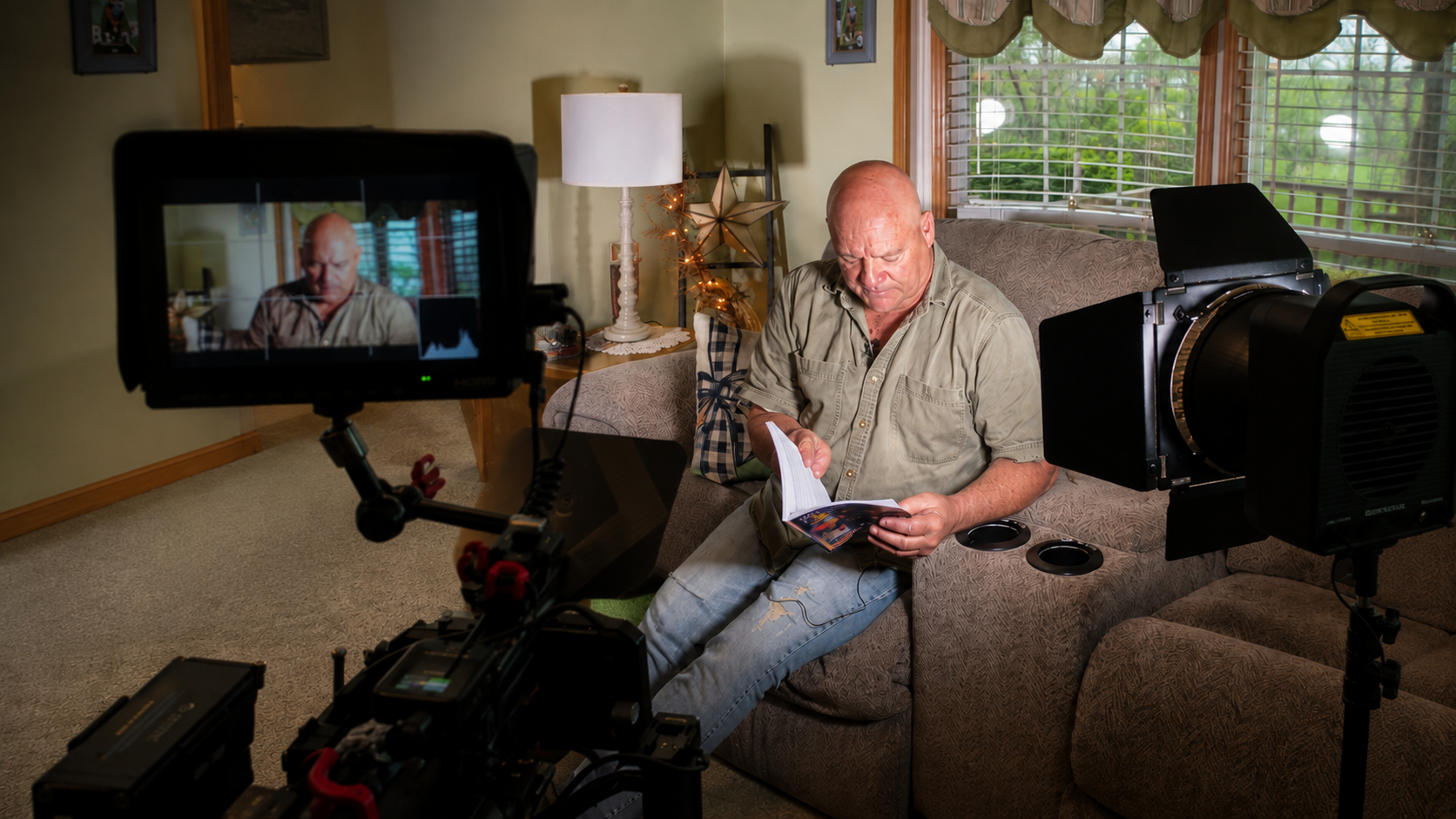 Behind the scenes of an interior living-room scene lit for camera on The Crossing